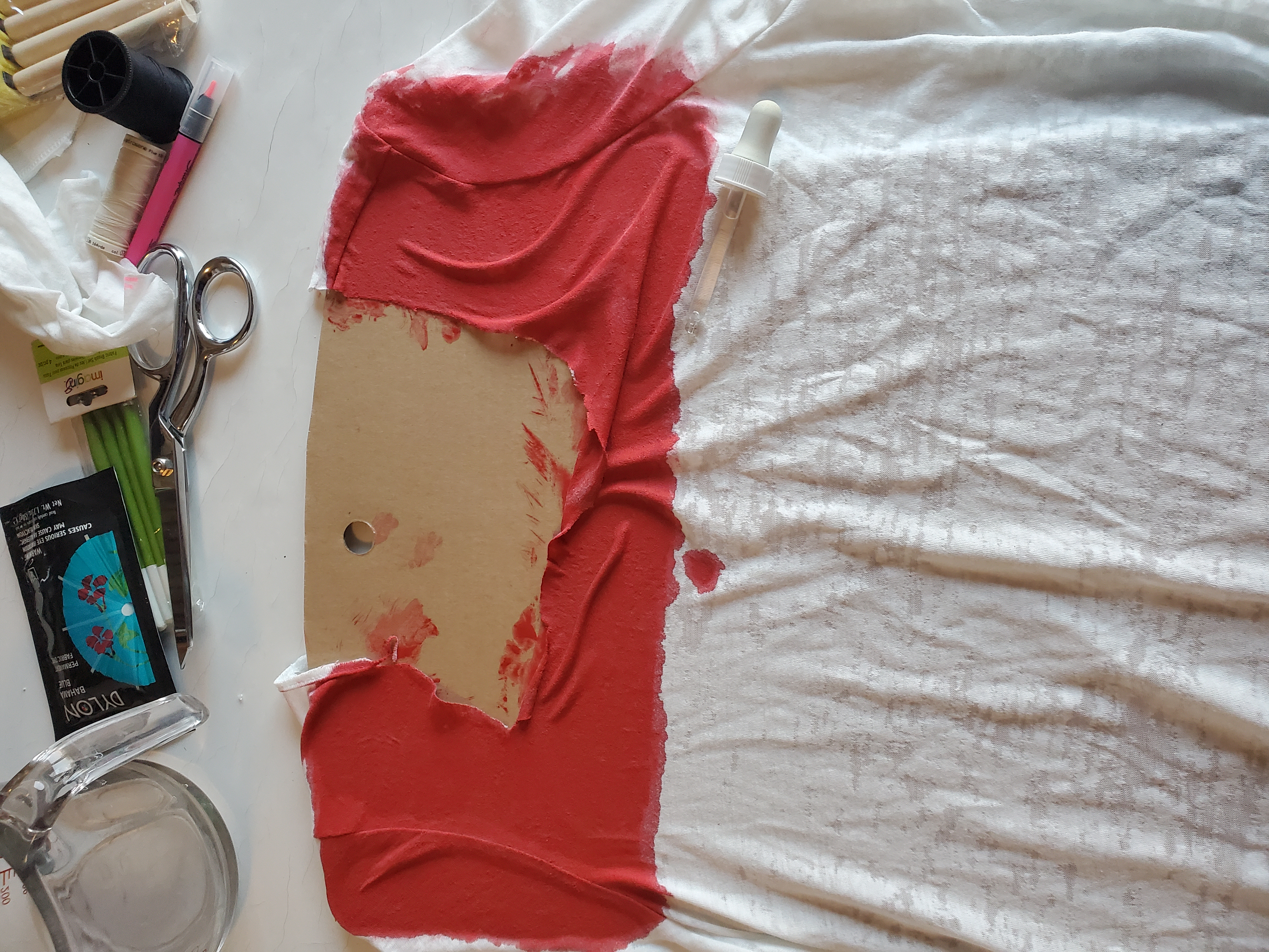 T-Shirt after cutting and first crimson paint application