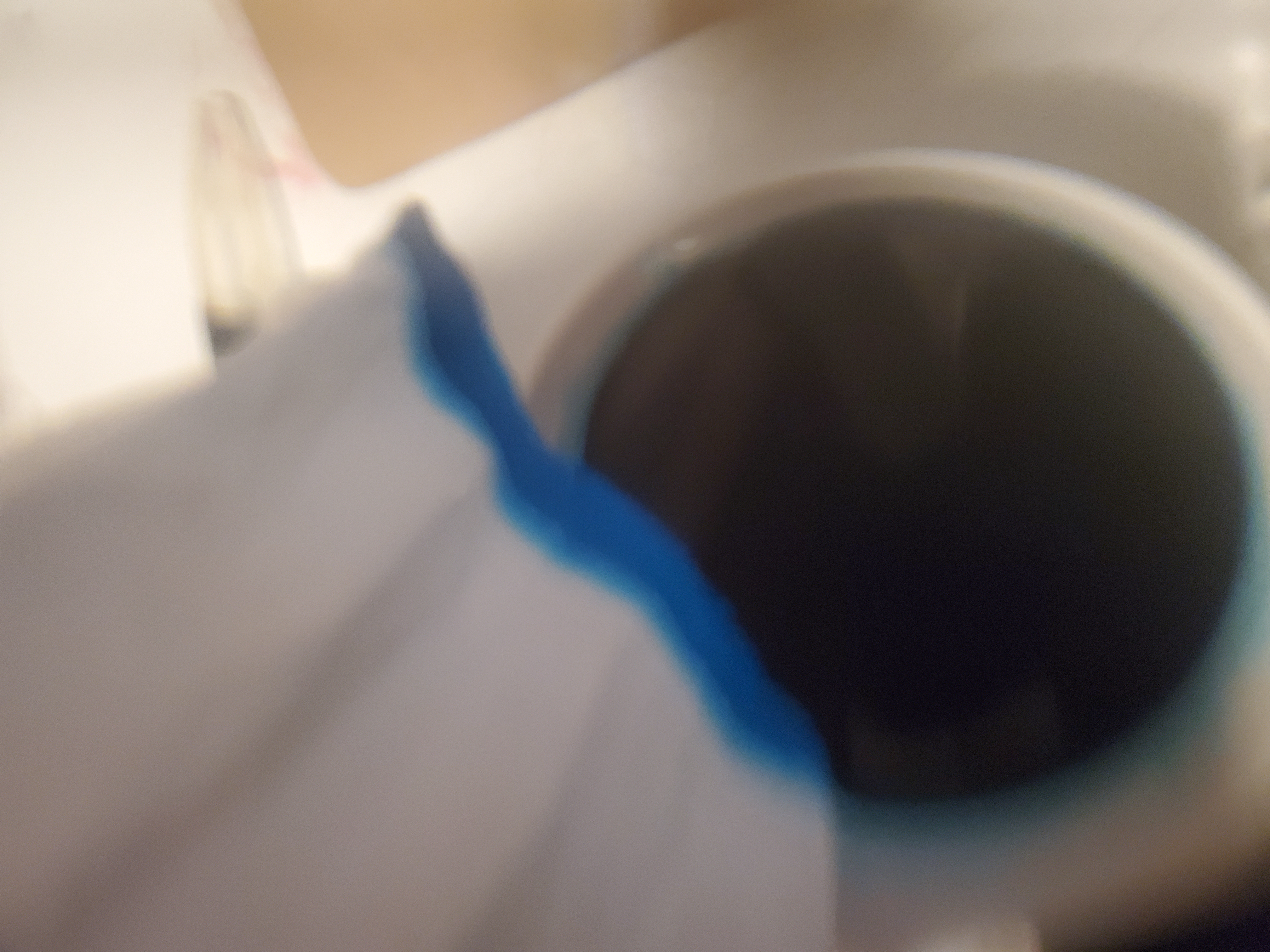Dip edge of sleeve into blue dye