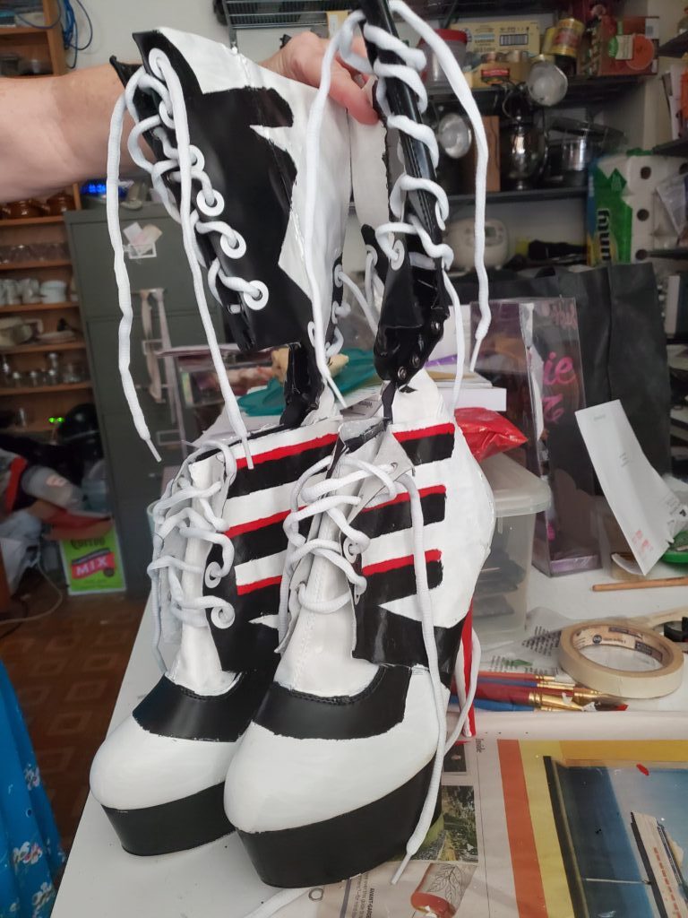 Finished, painted, laced boots